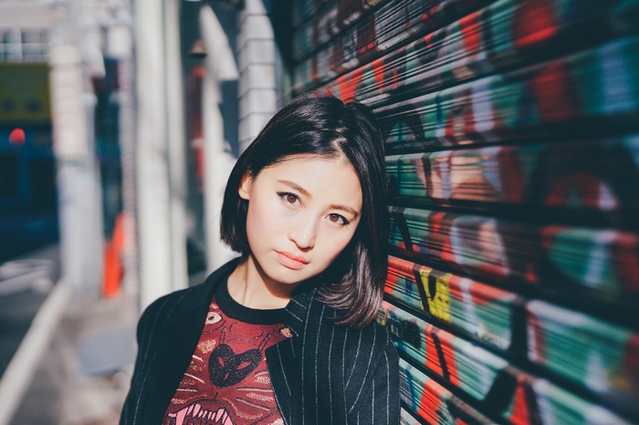 Woman with short black hair and brown eyes