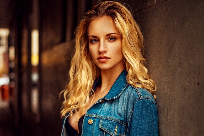 Miro Hofmann in a denim jacket with wavy blonde hair