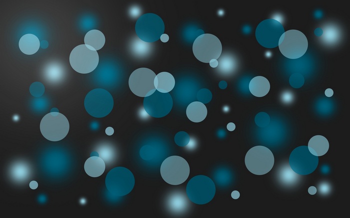 Bokeh effect with blue and white circles on dark background