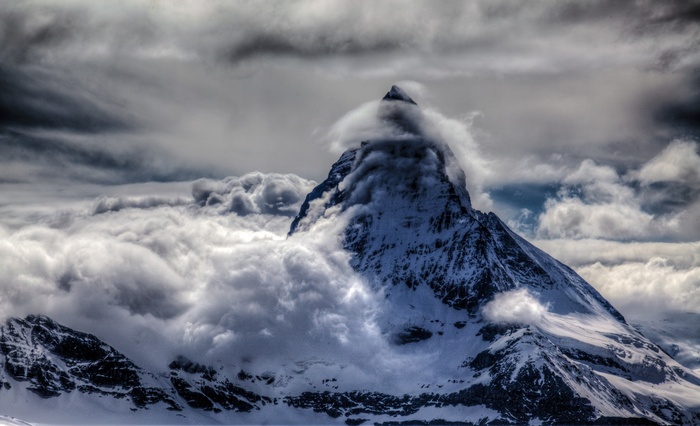 The Matterhorn mountain peak shrouded in clouds