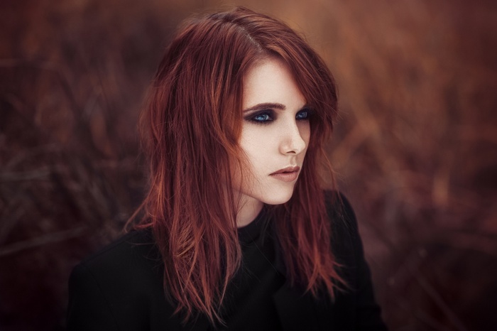 Portrait of a redhead woman with blue eyes