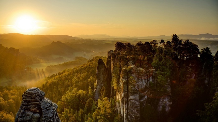 Sunrise over Saxon Switzerland valley with rock formations