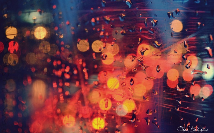 Water drops on glass with bokeh lights