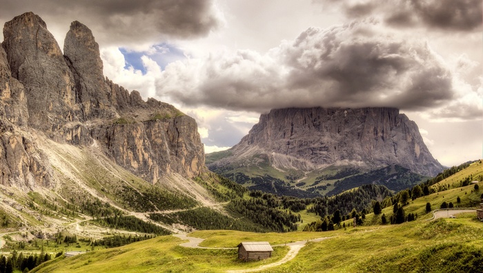 Mountains landscape with a small cabin