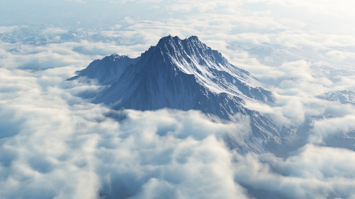 Snow-capped mountains emerge from clouds