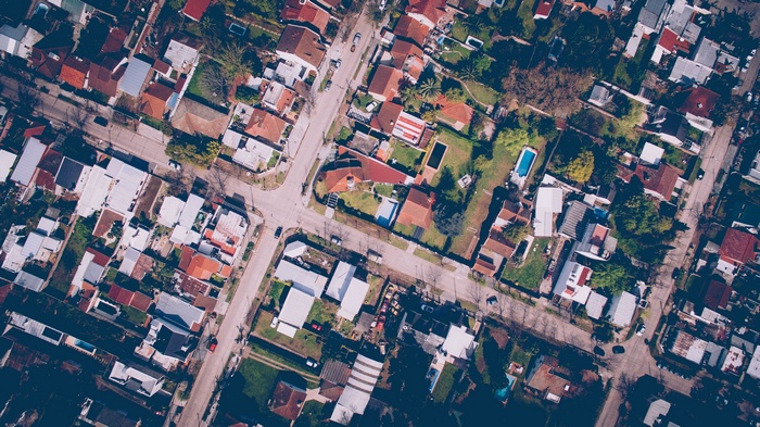 Aerial view of a suburban neighborhood with houses and trees