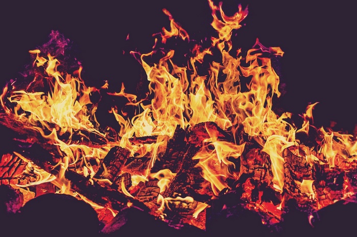 Close-up of a bonfire with glowing embers