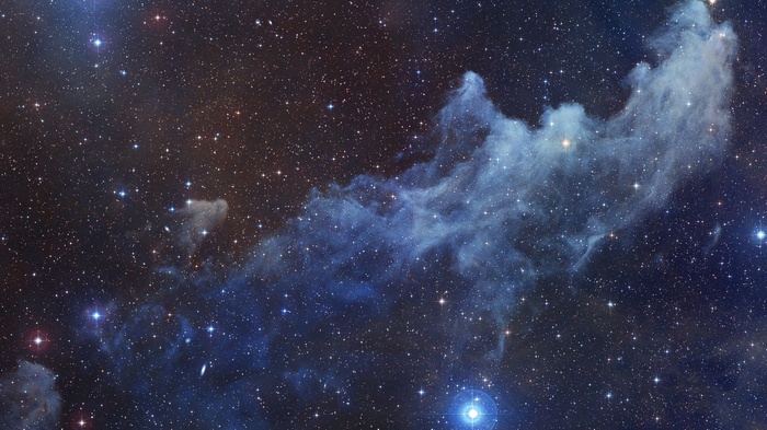 Blue and brown nebula with stars in space
