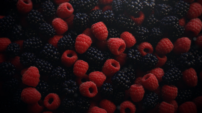 Close-up of fresh raspberries and blackberries