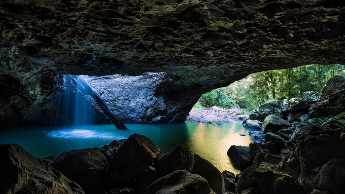 Cave with waterfall and turquoise water