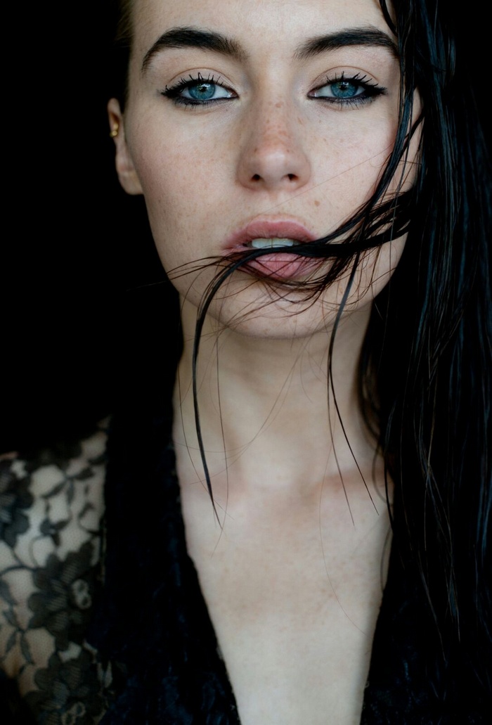 Woman with blue eyes and black hair