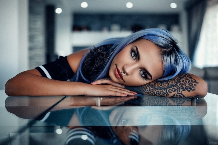 Felisja Piana with blue dyed hair and tattoos