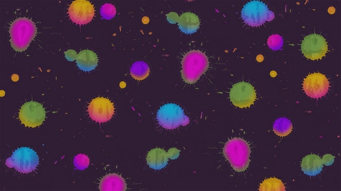 Colorful paint splatters on a dark background