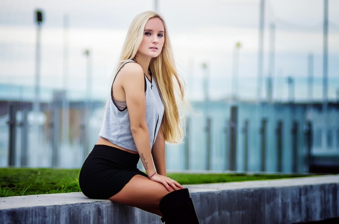 Adriano Perticone model with blonde hair wearing a skirt