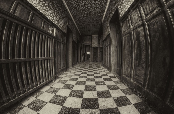 Sepia hallway with checkered floor and fisheye lens effect