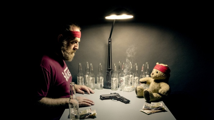 Man plays Russian Roulette with a teddy bear and a gun