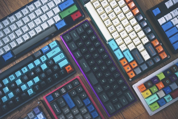 Collection of mechanical keyboards with colorful keycaps