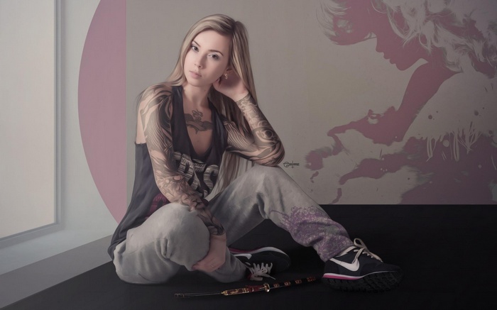 Woman with tattoos wearing Nike