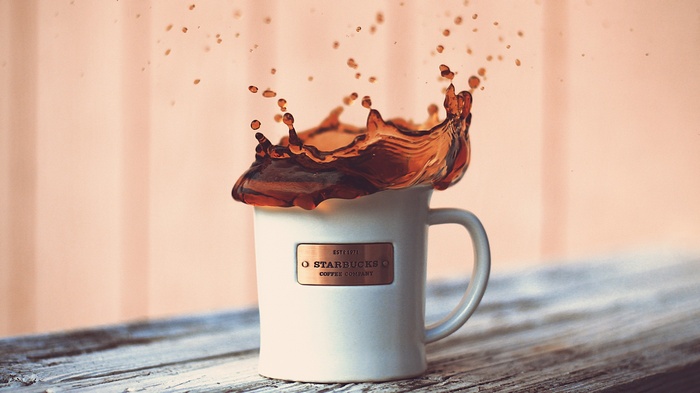 Starbucks coffee cup with splash