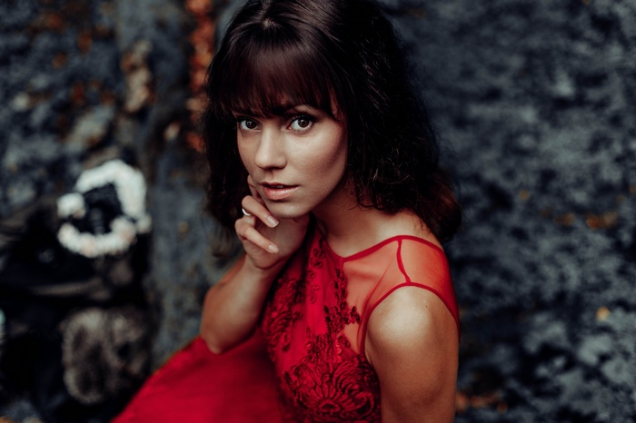 Woman in red dress looking at viewer