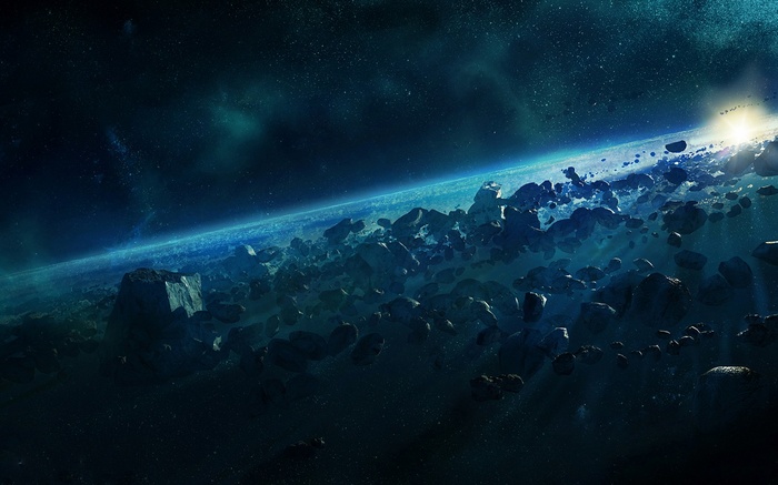 Asteroid field orbiting a blue planet in space