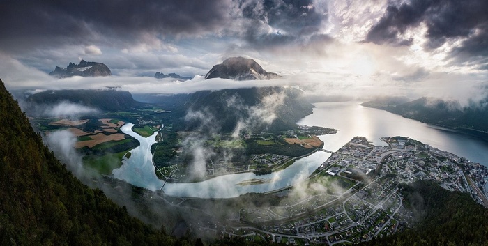 Panorama of a Norwegian fjord with a cityscape and mountains