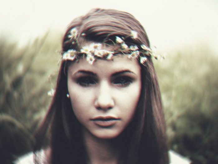 Woman with a flower crown in a field