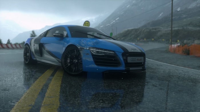 Blue Audi R8 on a wet mountain road