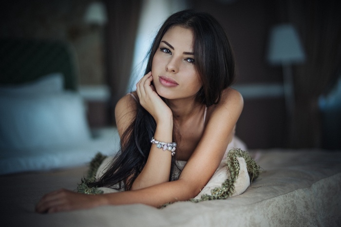 Portrait of a woman with dark hair and tanned skin