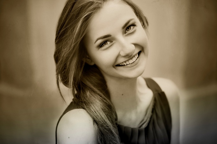Sepia portrait of a smiling woman