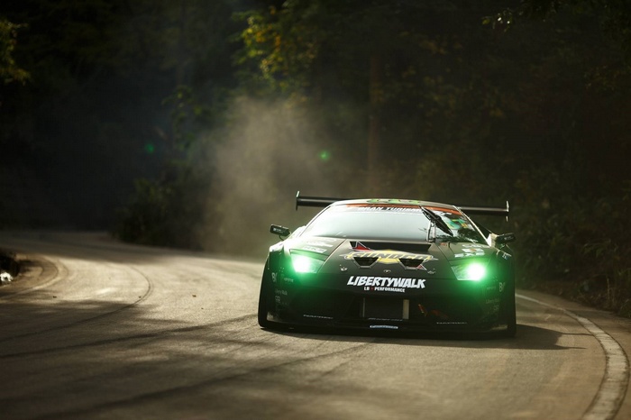 Green Liberty Walk Lamborghini drifting on a forest road