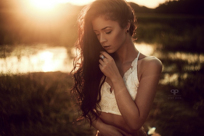 Woman with long hair at sunset