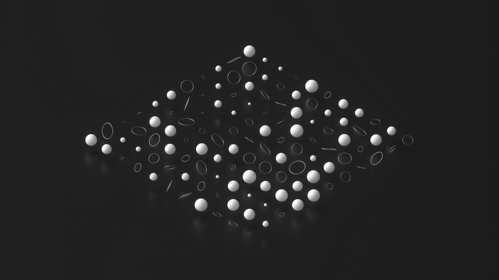 Abstract arrangement of spheres and rings on a dark surface
