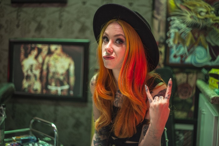Megan Massacre with orange hair and tattoos