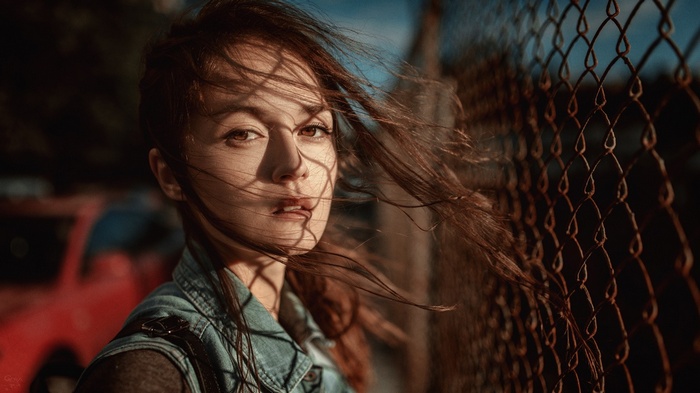 Portrait of a woman with auburn hair in the wind
