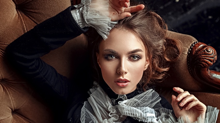 Alla Berger, a brunette woman with dramatic makeup