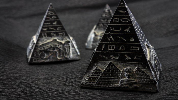 Egyptian pyramids with hieroglyphs and sphinx