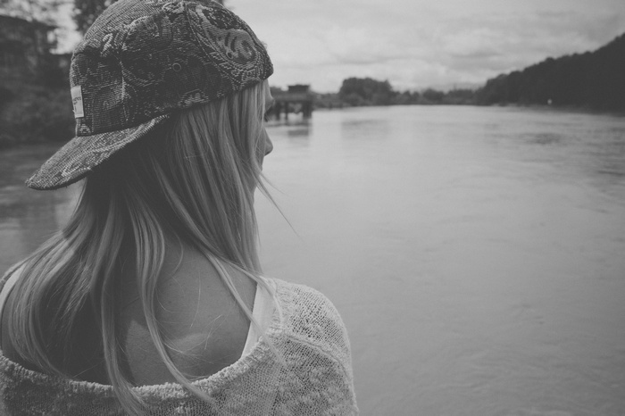 Monochrome photo of a woman wearing a cap