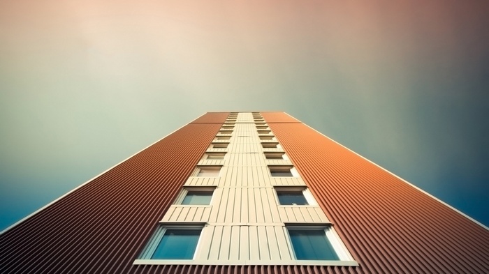Worm's eye view of a tall building with windows