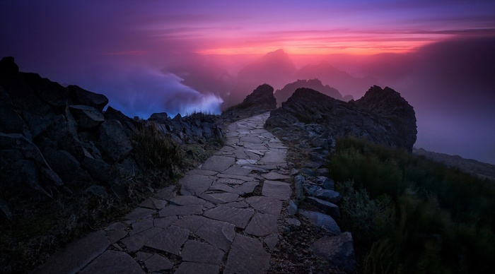 Stone path on a mountain ridge at sunset