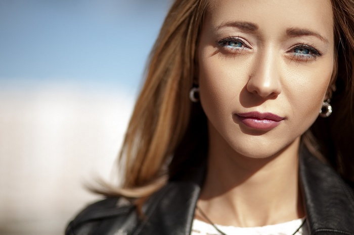 Close-up portrait of a woman with blue eyes