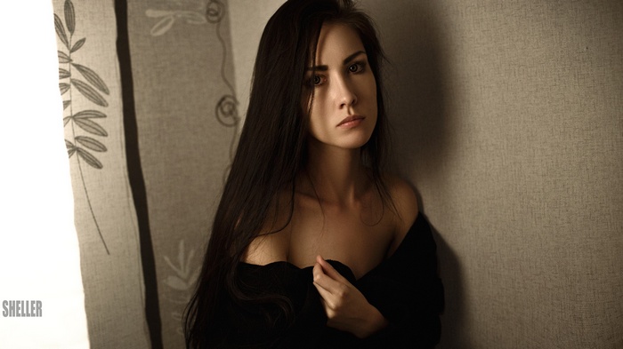 Portrait of a woman with long black hair by Igor Sheller