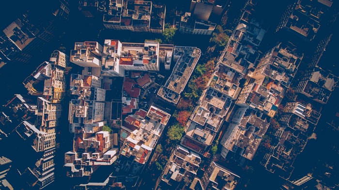 Aerial view of a dense city with buildings and trees
