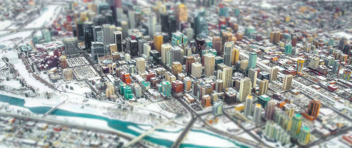Aerial tilt-shift photography of a snowy city skyline