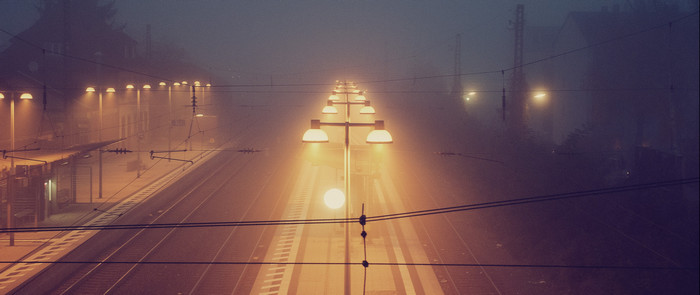 Train station at night with fog and lights