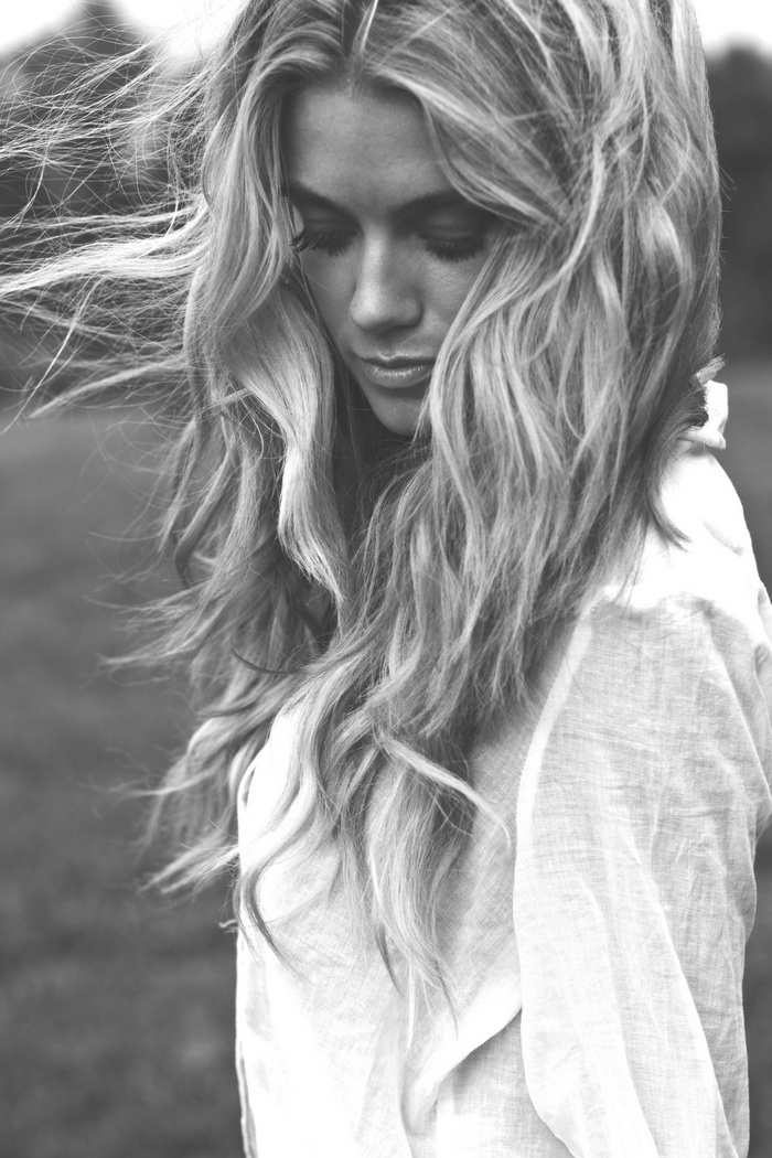 Monochrome portrait of a woman with long blonde hair