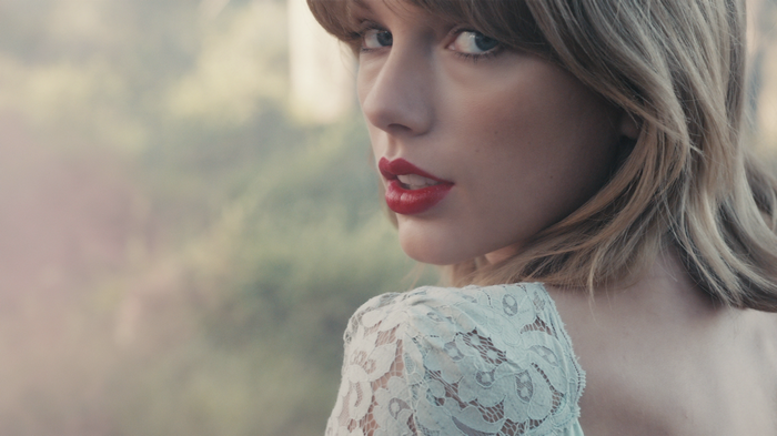 Taylor Swift in a light blue lace dress