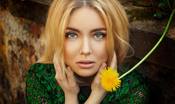 Elena Estetika with a dandelion flower