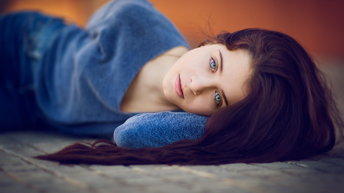 Woman with long brown hair and blue eyes