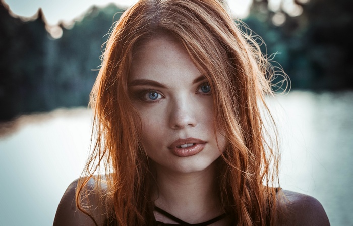 Woman with red hair and blue eyes